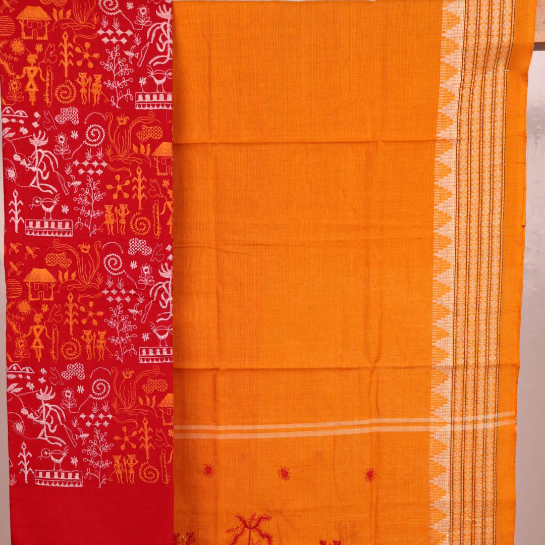 Close-up view of the yellow blouse piece with red doll patterns in Sambalpuri style cotton dress material