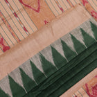 Close-up of the green and off-white plain Tussar silk saree, highlighting its natural slub texture.