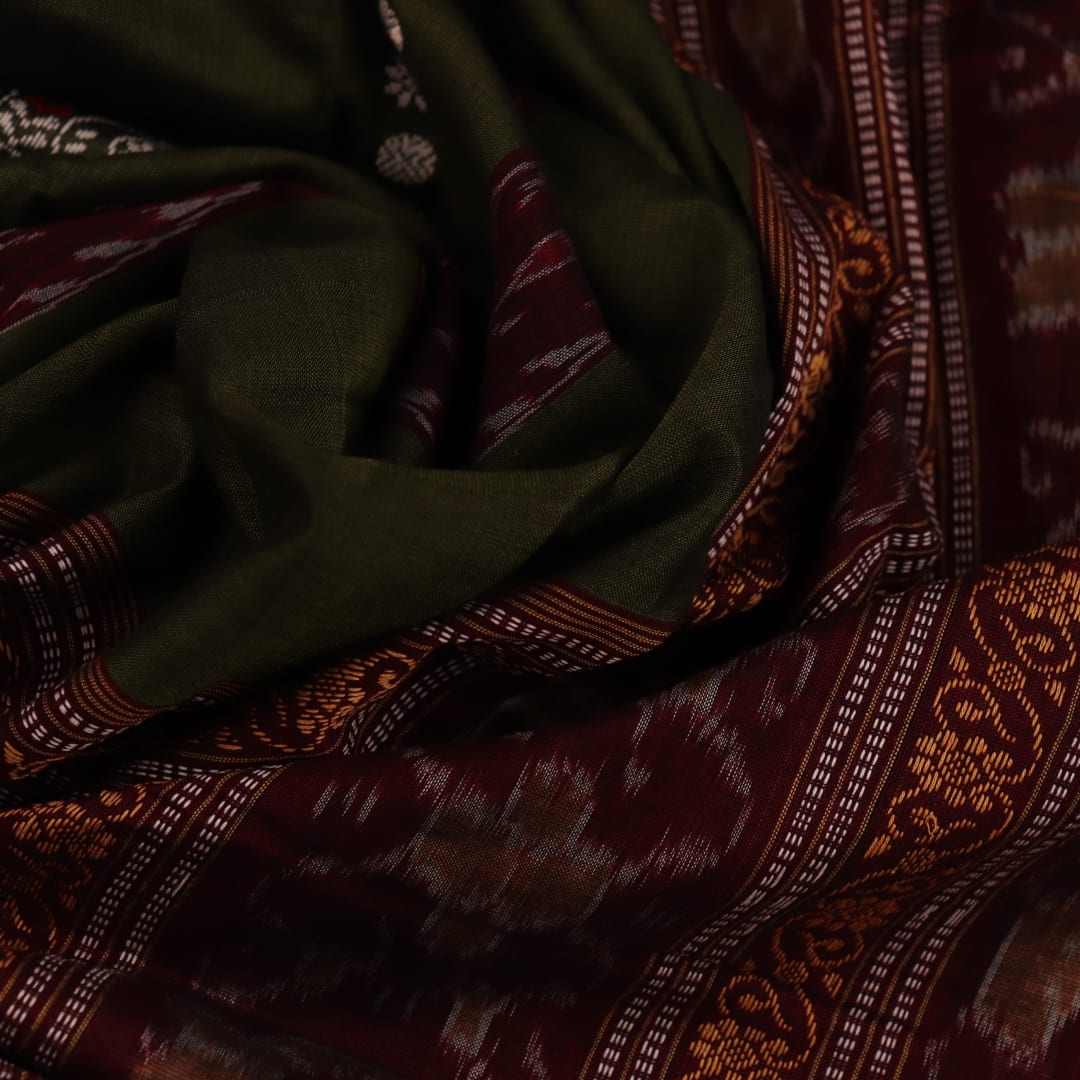 Full view of a green and rust cotton Bomkai saree with traditional butta patterns.