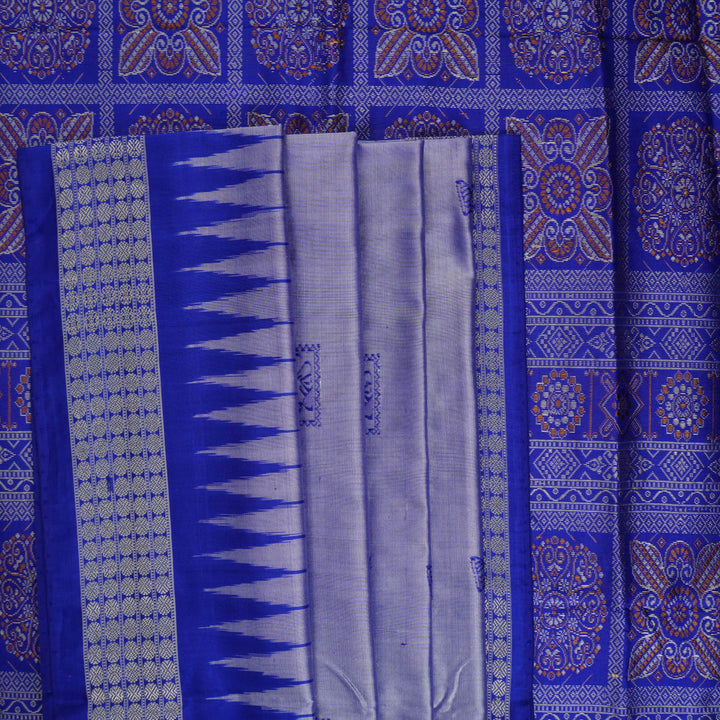 Ultra close-up of Bomkai Silk Saree fabric, highlighting the exquisite grey and blue weave texture.