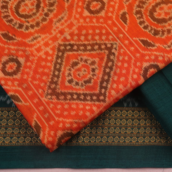 Blouse piece detail of an orange and green motif Sambalpuri cotton dress material.