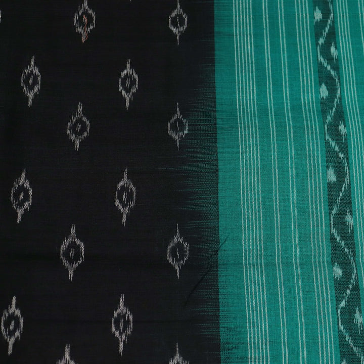 Styling view of a black and green Sambalpuri cotton dupatta with intricate motifs