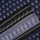 Model wearing a grey and black Sambalpuri cotton saree with traditional ikat motifs in a classic ethnic drape.