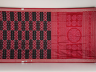 Close-up of the rich, smooth texture of the black Sambalpuri silk saree fabric.