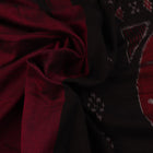 Plain maroon and black Sambalpuri cotton saree, elegantly draped.