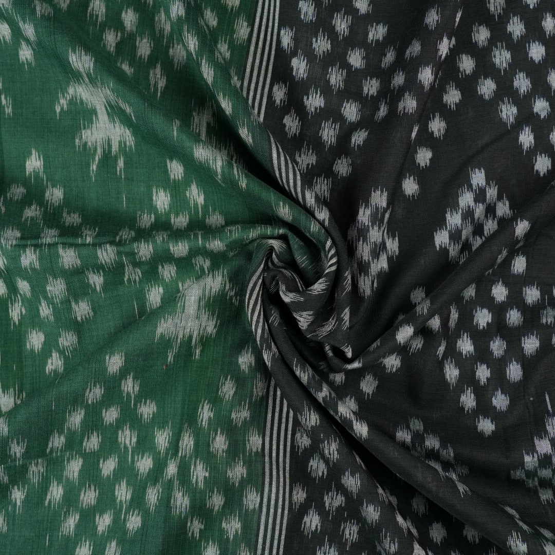 Elegant model draping a green and black Sambalpuri cotton saree with traditional Odisha handloom motifs.