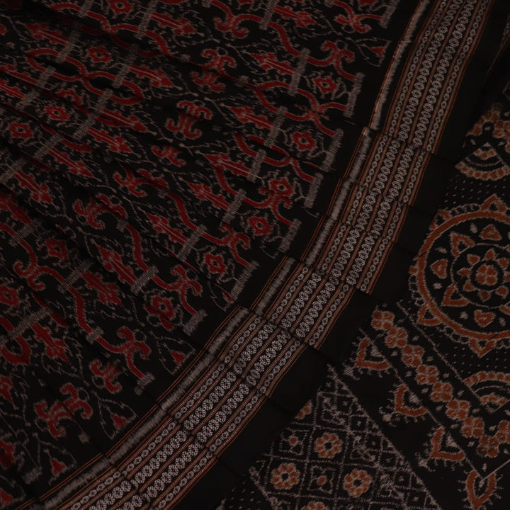 Full view of an orange and black Sambalpuri cotton saree with intricate motifs