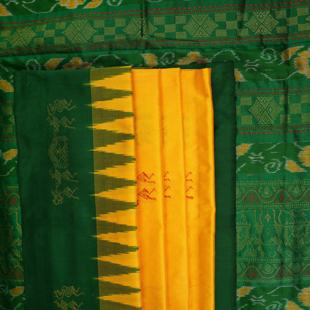Extreme close-up of yellow Bomkai Silk Saree fabric, revealing the rich silk texture and weave.