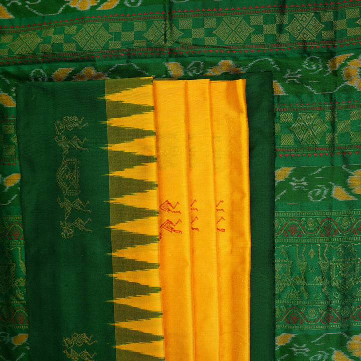 Extreme close-up of yellow Bomkai Silk Saree fabric, revealing the rich silk texture and weave.