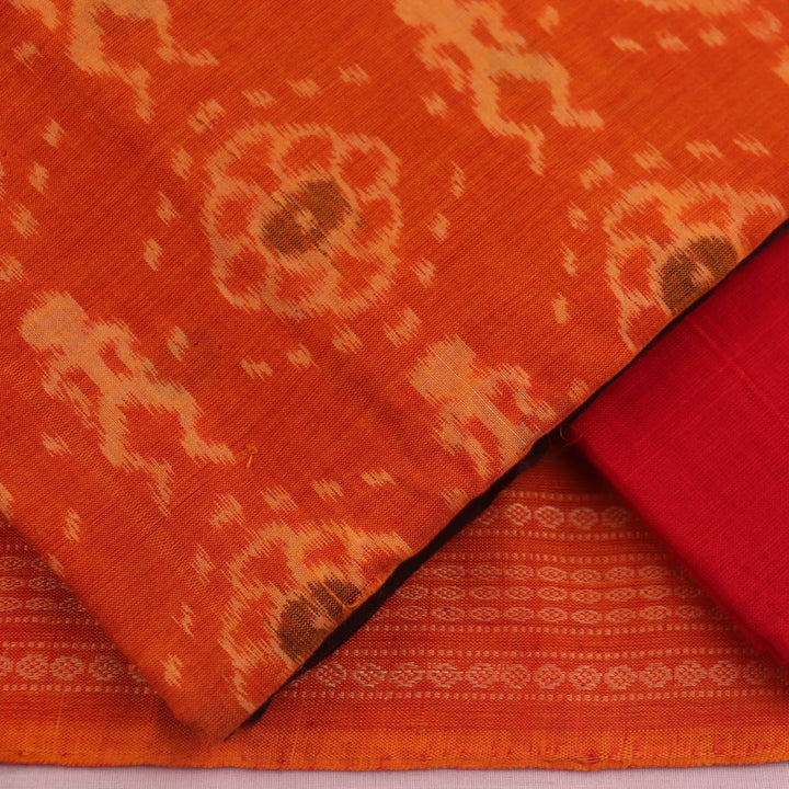 Detail of the rust and red Sambalpuri cotton dress material's blouse piece with motifs.