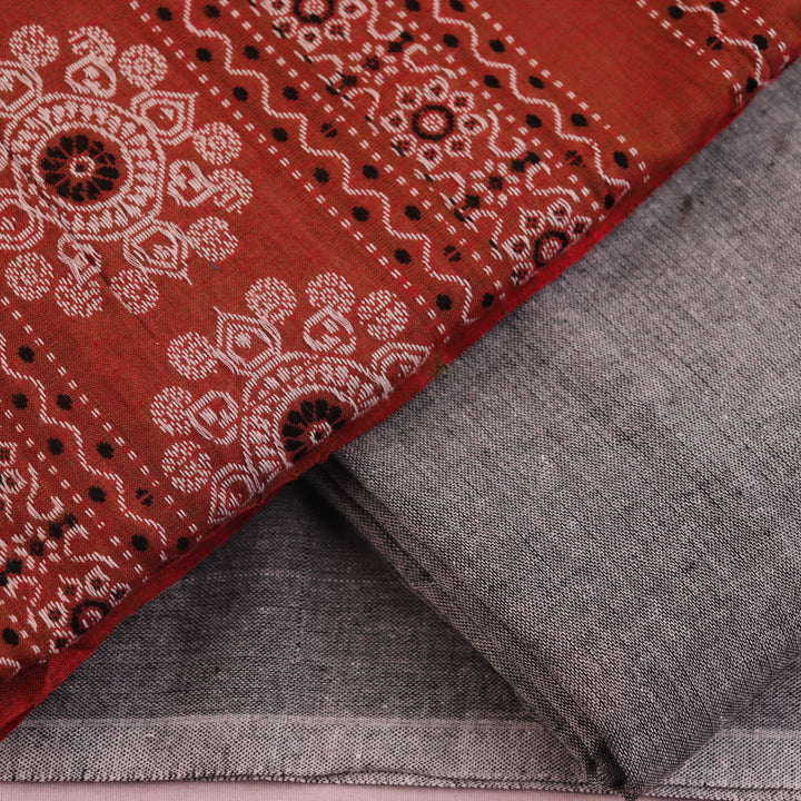 Coordinating Bomkai Cotton blouse piece detail, showcasing subtle multi-color patterns on a grey fabric.