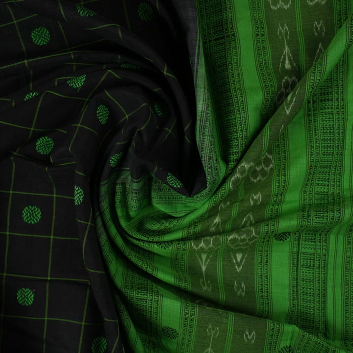 Full flat layout of a black Sambalpuri cotton saree with green butta patterns and an intricate ikat border.