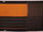 Woman draped in a yellow and black Sambalpuri cotton saree, showcasing the stylish drape and motif pattern.