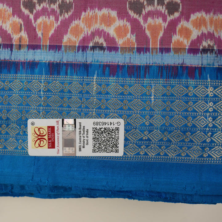 Close-up of the multi-color blue Sambalpuri silk saree fabric texture, highlighting intricate weave.