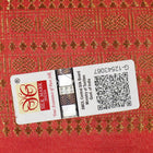 Close-up of rust Sambalpuri silk fabric, revealing its luxurious texture and fine handloom weave.