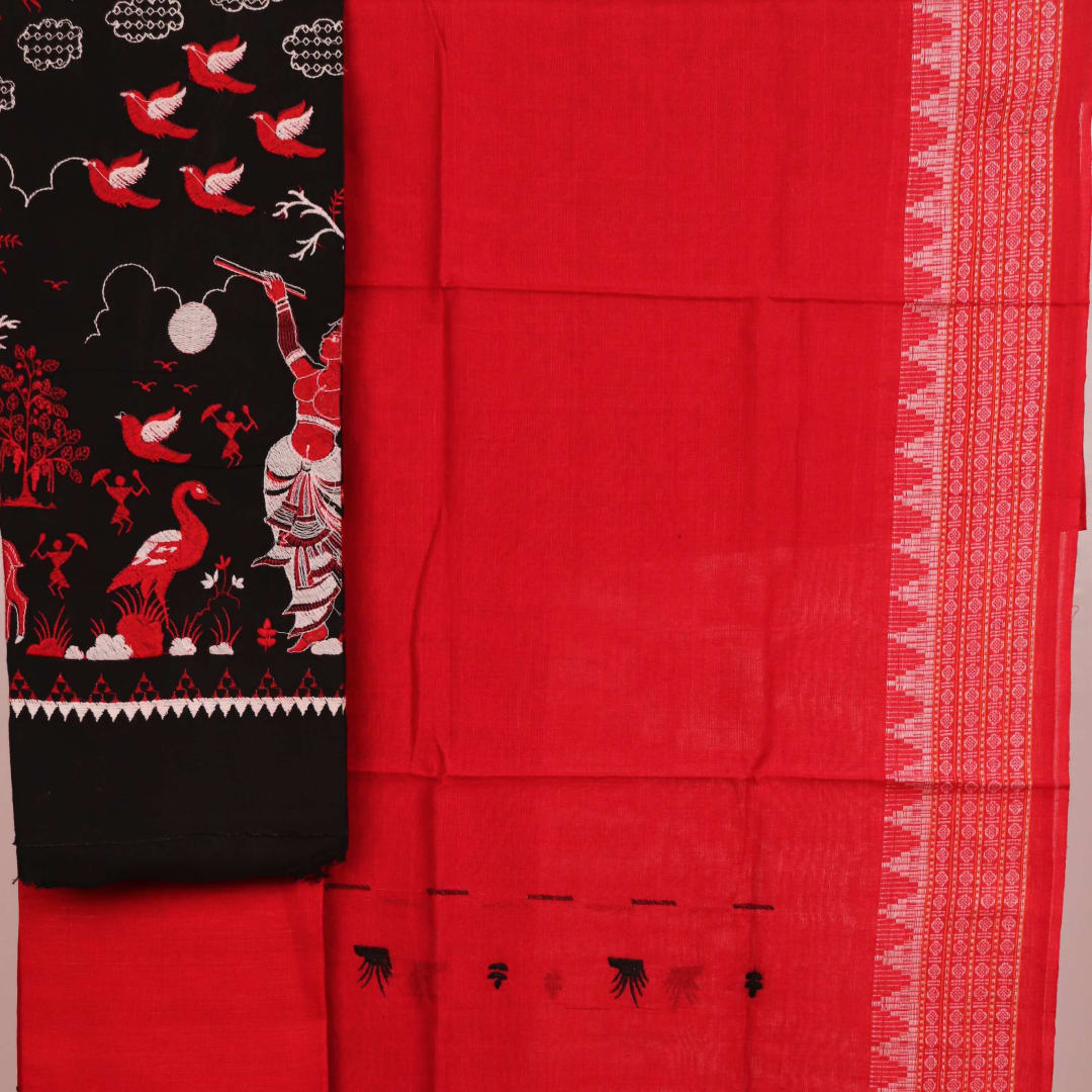 Close-up view of black and red cotton Sambalpuri dress material with doll pattern.