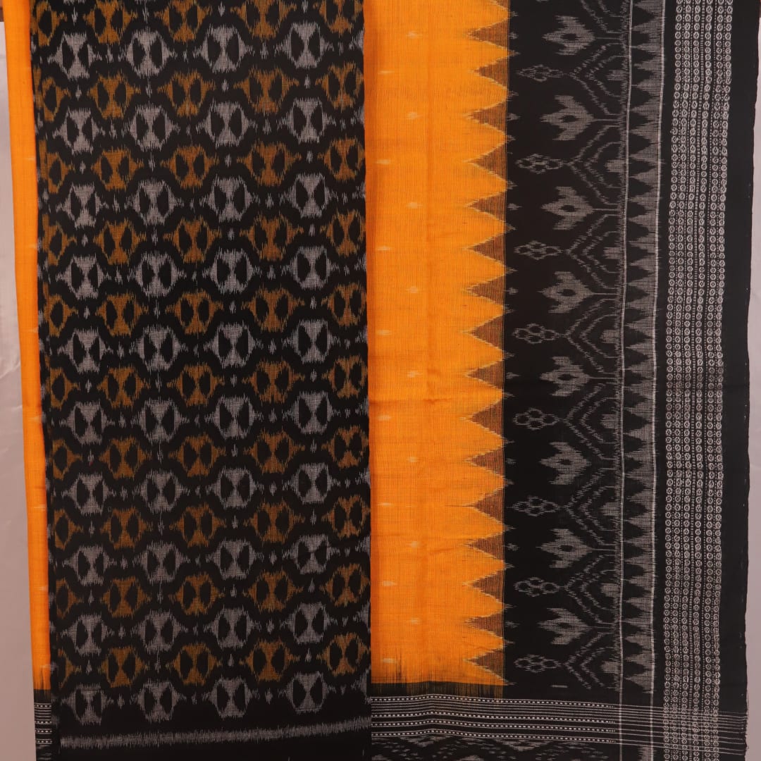 Detail of black and yellow Sambalpuri cotton dress material blouse piece with motifs.