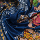 Close-up of handloom blue silk Patachitra saree fabric, showcasing the fine texture and hand-painted details.
