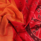 Draped plain yellow Sambalpuri cotton saree with red border.