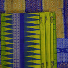 Detailed close-up of the exquisite green Bomkai Silk Saree fabric, highlighting its luxurious silk weave.