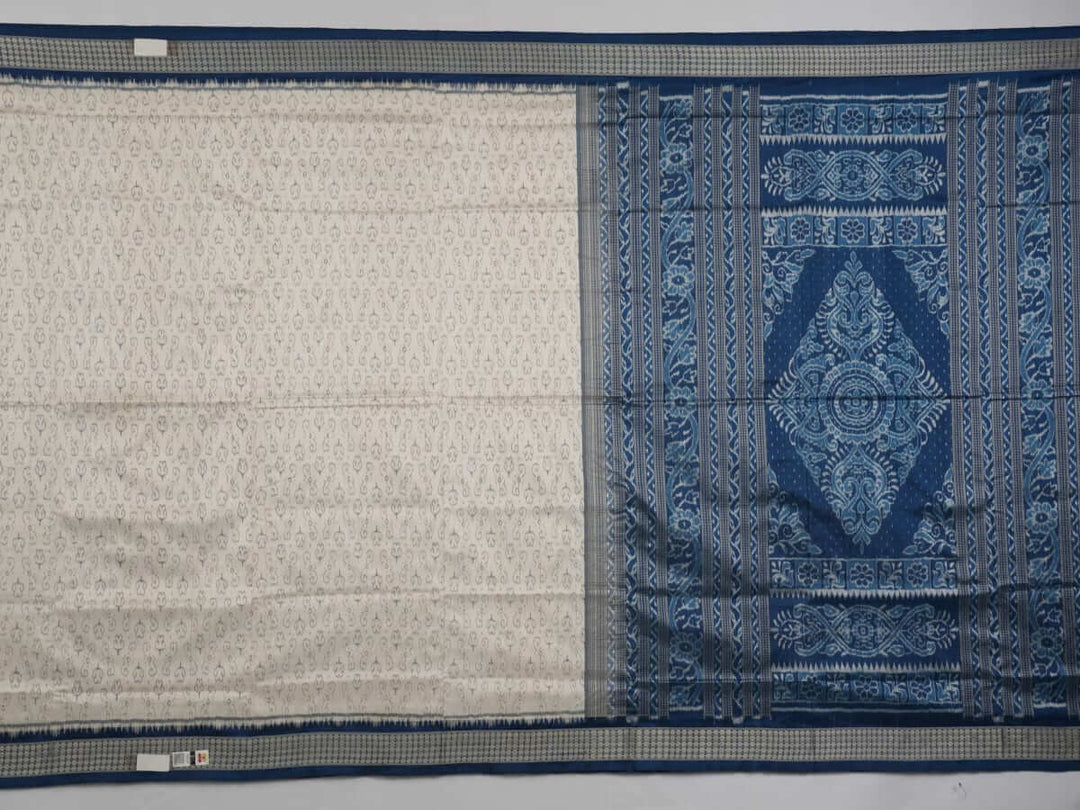 Close-up of premium fabric texture and handloom weave on a white and blue Sambalpuri silk saree