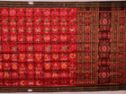 Red and black silk Khandua saree with Nabakothi pattern, styled or draped view showing the overall look.