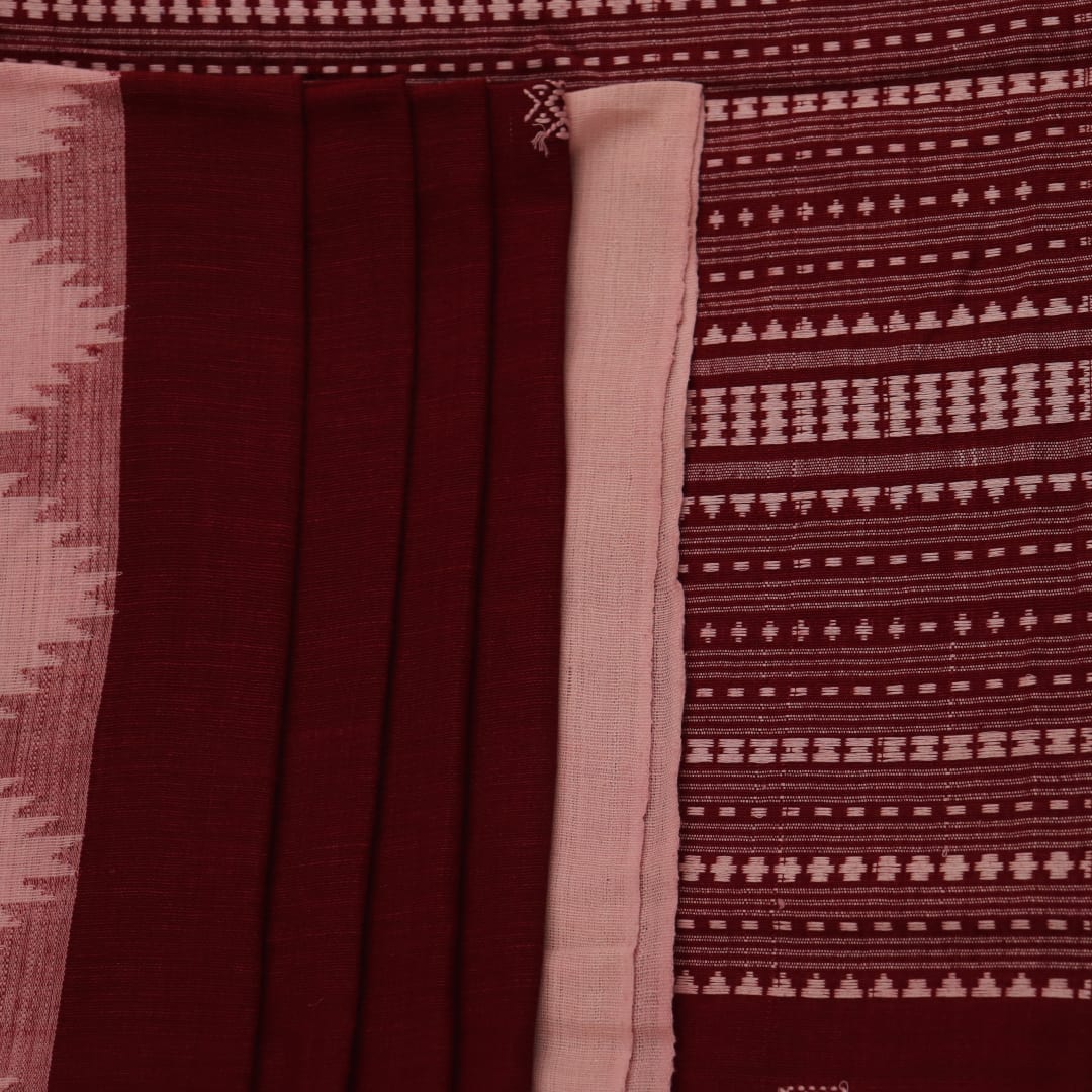 Full view of a maroon and off-white cotton Kotpad saree adorned with a traditional butta pattern.