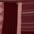 Full view of a maroon and off-white cotton Kotpad saree adorned with a traditional butta pattern.