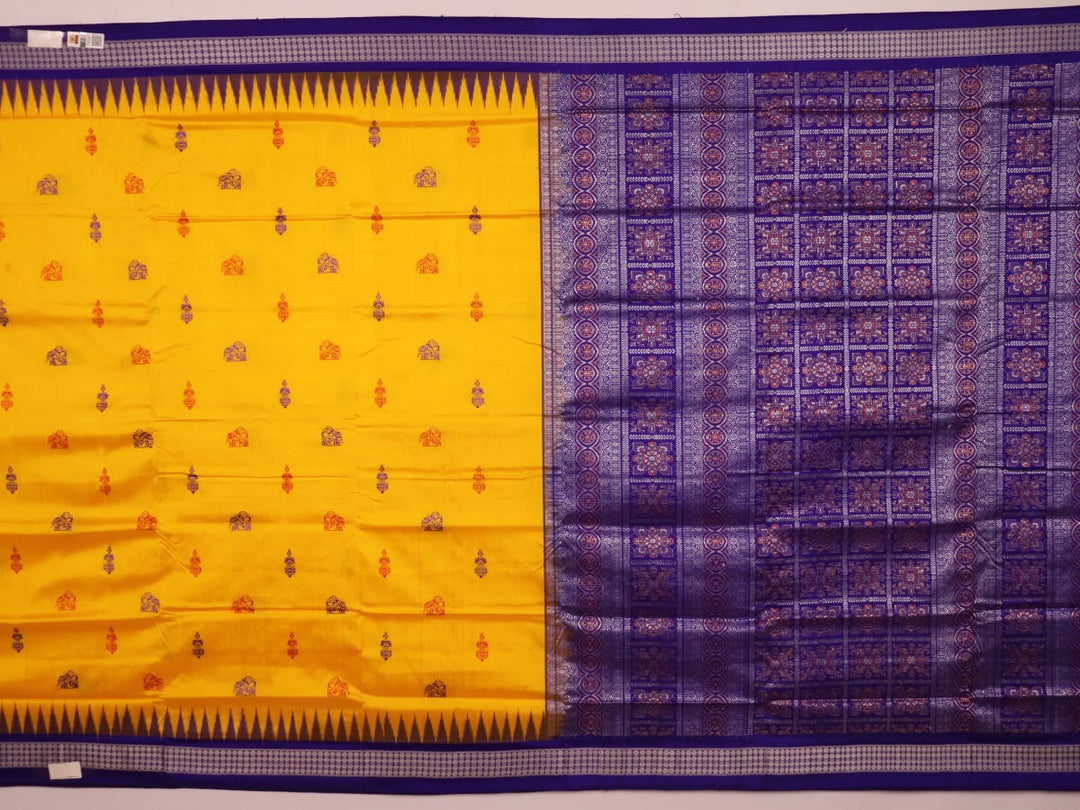 Close-up showcasing the yellow and blue butta pattern on the silk Bomkai saree fabric.