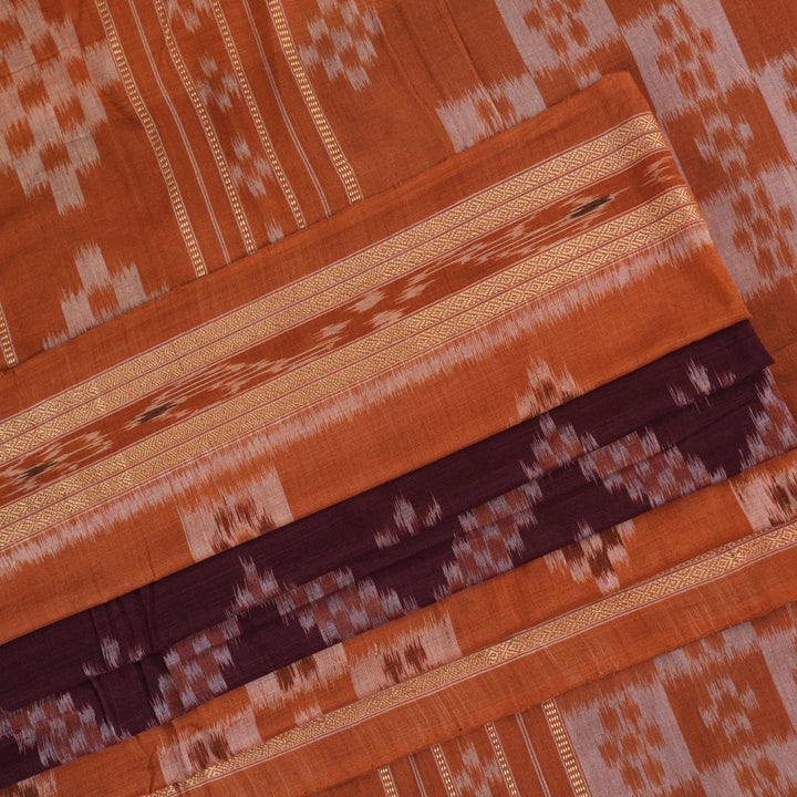 Model draped in a maroon and brown Sambalpuri cotton saree showcasing traditional Odisha handloom style.