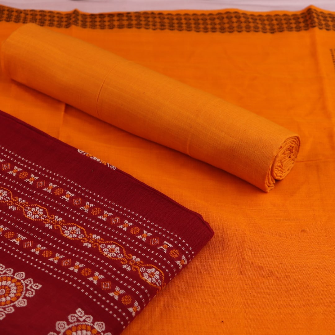 Bomkai cotton dress material blouse piece in maroon, featuring a subtle butta pattern.