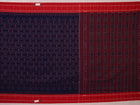 Gracefully draped blue Sambalpuri cotton saree with red motifs, highlighting its design and flow.