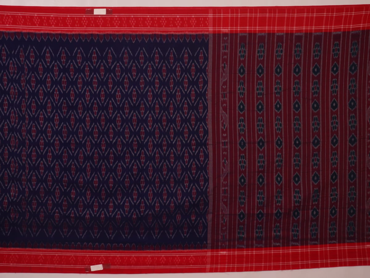 Gracefully draped blue Sambalpuri cotton saree with red motifs, highlighting its design and flow.
