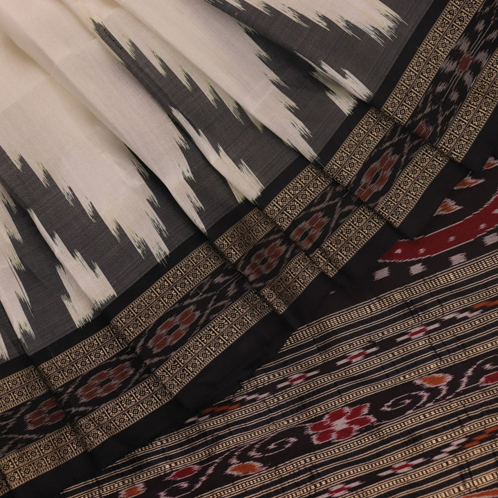 White Khandua silk saree draped, showcasing its plain body and simple elegance.