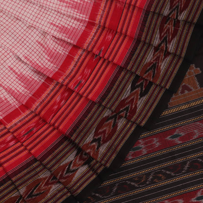 Saree styling: White and black Sambalpuri cotton saree with motifs, draped to showcase the overall look.