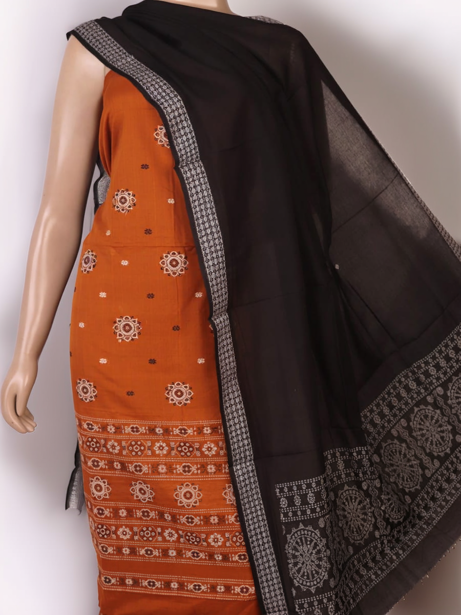 Detailed view of the black Bomkai cotton blouse piece, matching the yellow dress material.