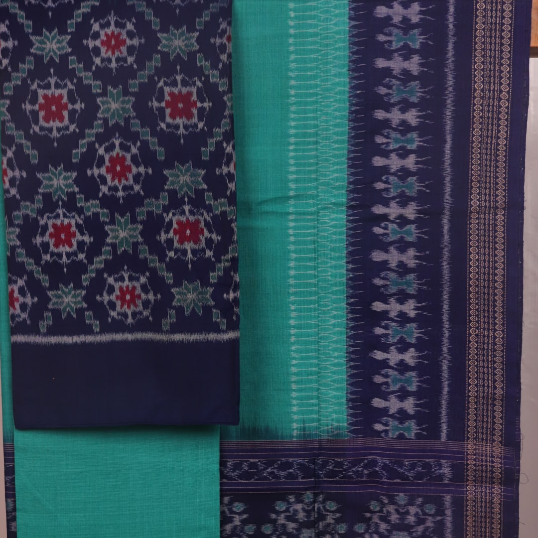 Detail of a Sambalpuri cotton dress material's blouse piece, featuring blue and green motifs.