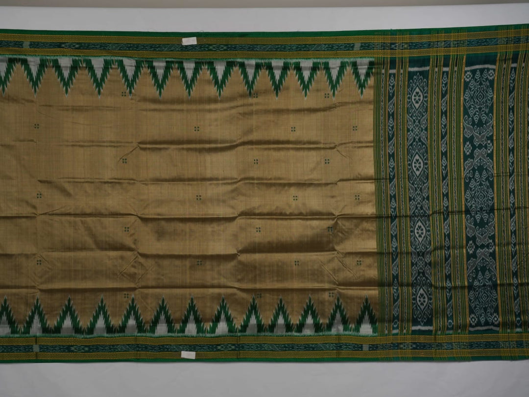 Elegant styling of a brown and green Khandua silk saree with butta work as draped on a model.