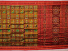 Green Khandua silk saree styled and draped to showcase the Nabakothi pattern, a traditional handloom saree.