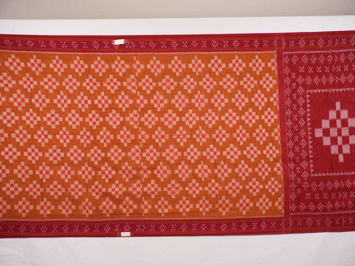 Full drape styling of a brown and maroon Sambalpuri cotton saree with motifs, modeled for elegant look.