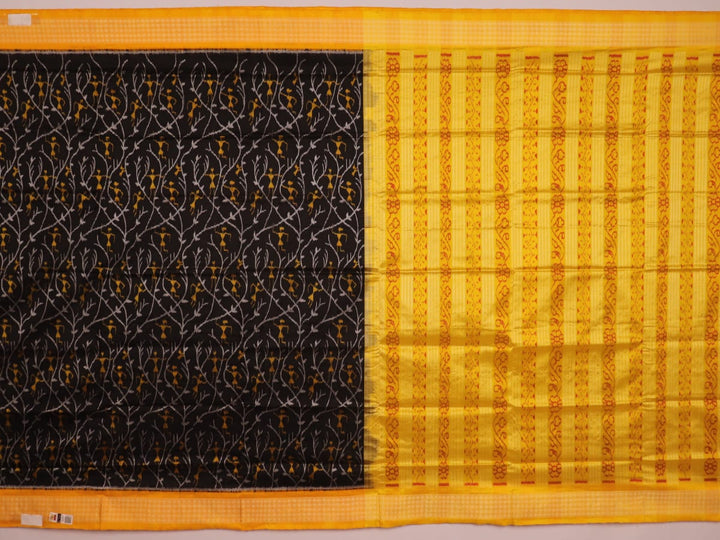 Close-up showcasing intricate silk fabric texture in black and yellow motifs