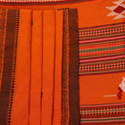 Full-length view of an orange cotton Berhampuri saree with a butta pattern and broad orange borders.
