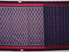 Blue Sambalpuri cotton saree with motifs, gracefully draped.