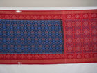 Full flat lay view of a blue and red Sambalpuri cotton saree showcasing the entire body and pallu design.
