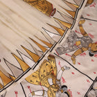 Close-up of white silk Patachitra saree, showcasing the handloom fabric's texture and subtle paint details.