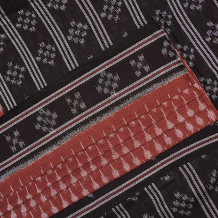 Full styling view of a model draped in a brown and black Sambalpuri cotton saree with traditional motifs.