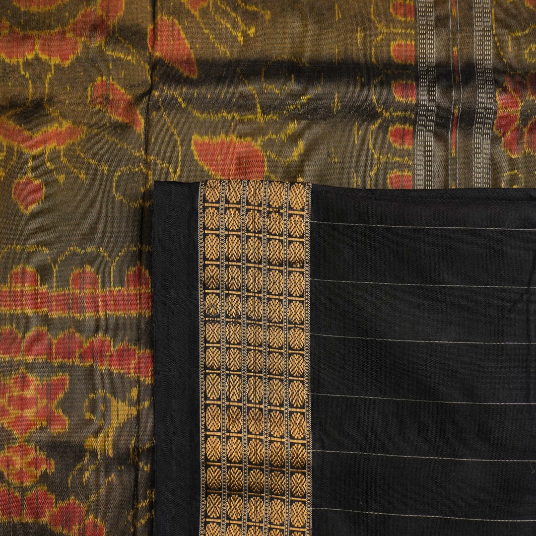 Extreme close-up of Sambalpuri Silk Saree fabric, revealing multi-color brown weave and tissue texture.