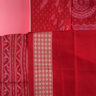 Close-up of the rich, smooth texture of the black Sambalpuri silk saree fabric.