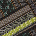 Full flat layout of the green and black Sambalpuri cotton saree with detailed motifs and pallu design
