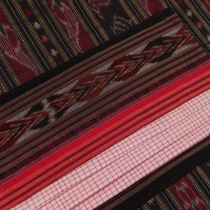 Woman draped in a white and black Sambalpuri cotton saree with motifs.
